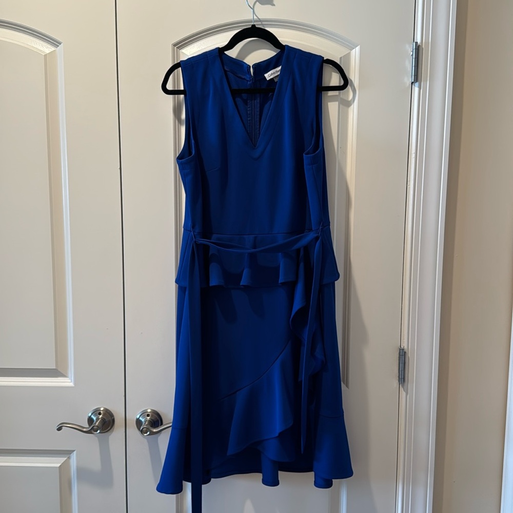 Blue peplum Calvin Klein dress.